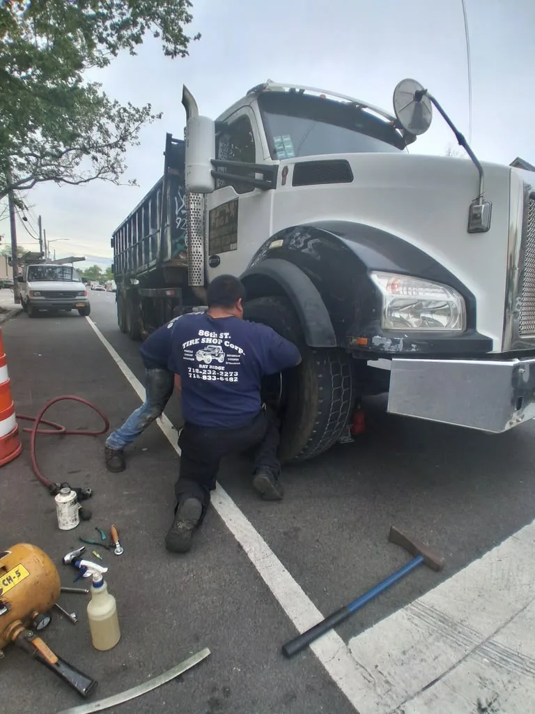 Technician servicing a commercial truck