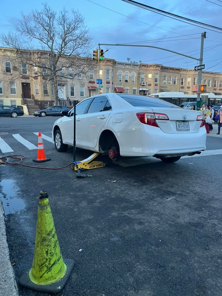 Sedan raised for tire service
